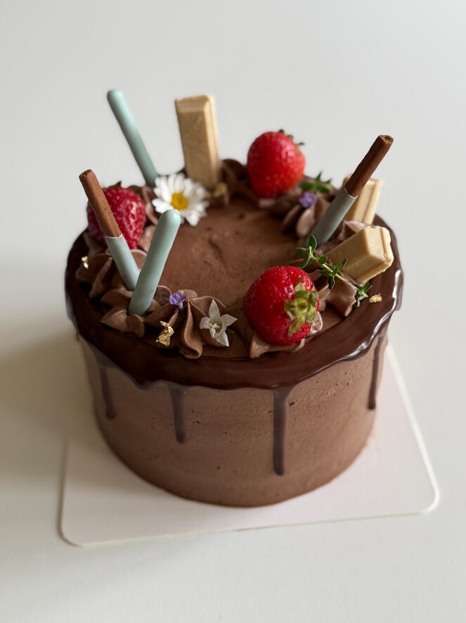 chocolate birthday cake with fruit and pocky and kit kat and dark chocolate drizzle