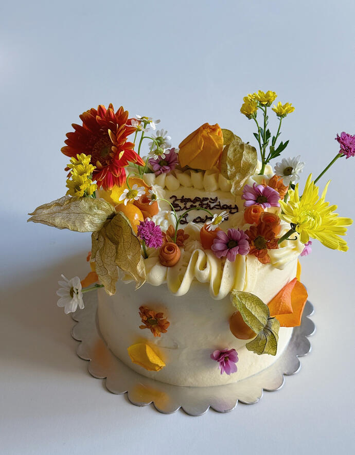 cake with modern piping and flowers all over