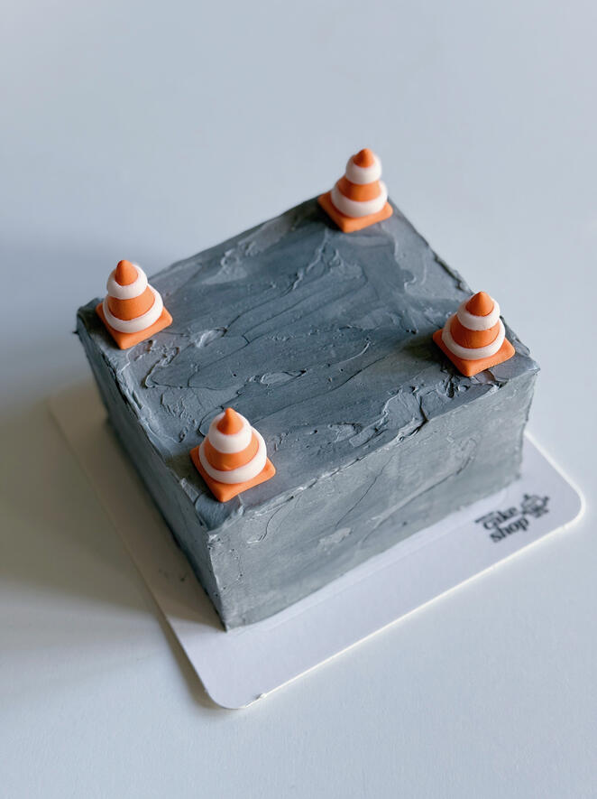Custom cake concrete block with construction cones